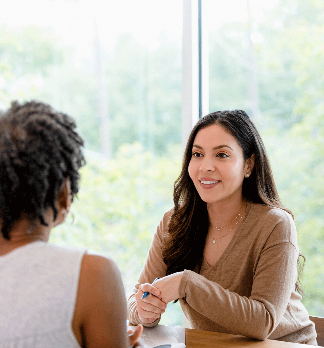 smiling woman meeting with housing counseler
