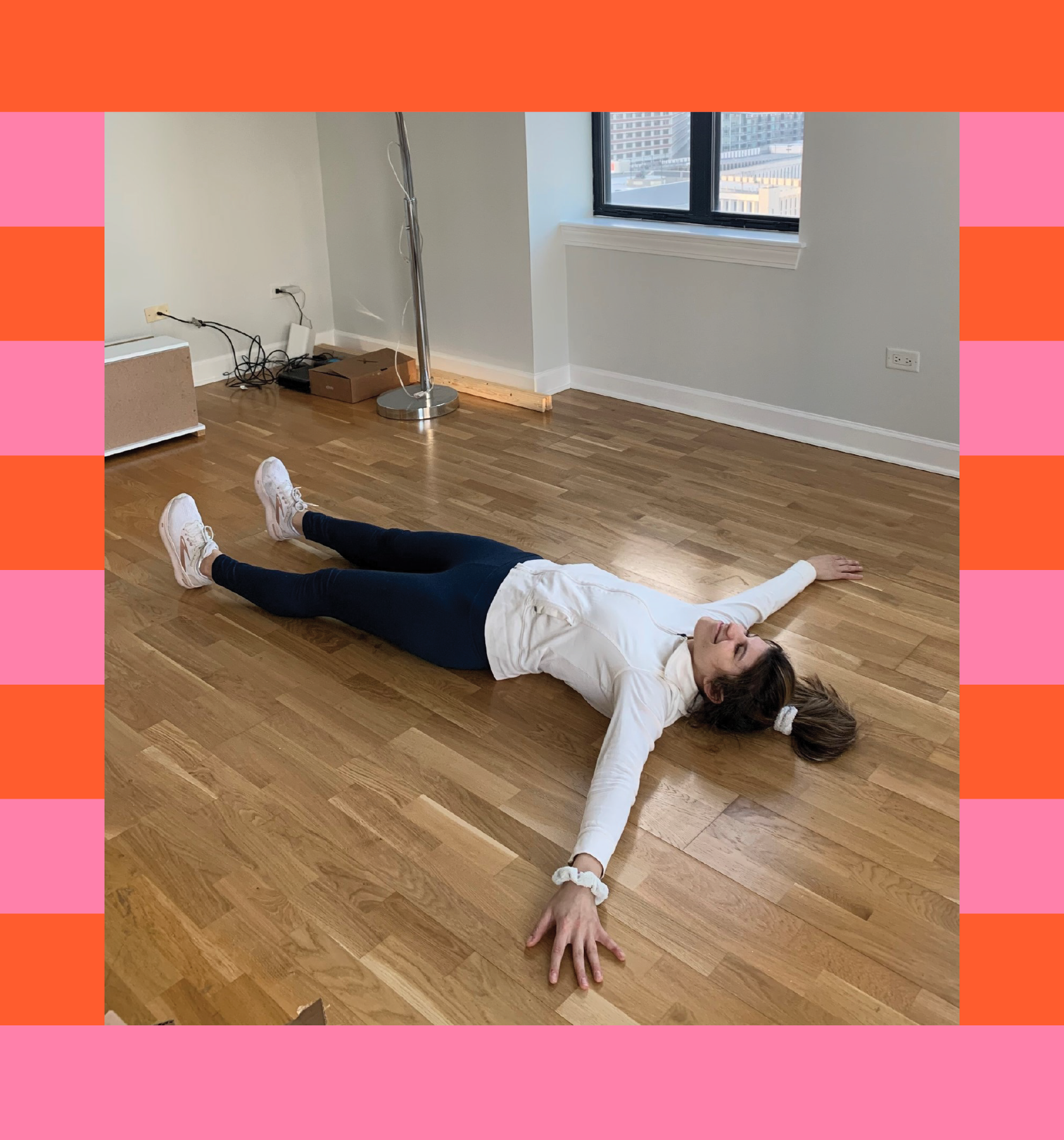 young woman laying on floor of new condo