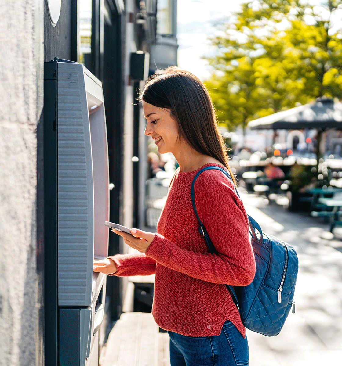 Woman at outdoor ATM