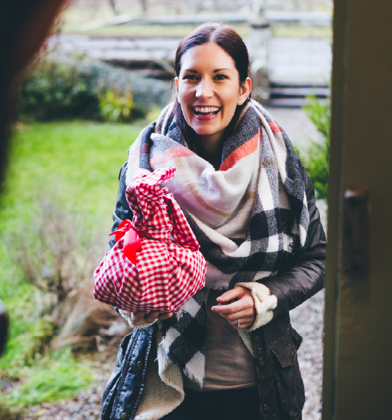 woman with gift at door