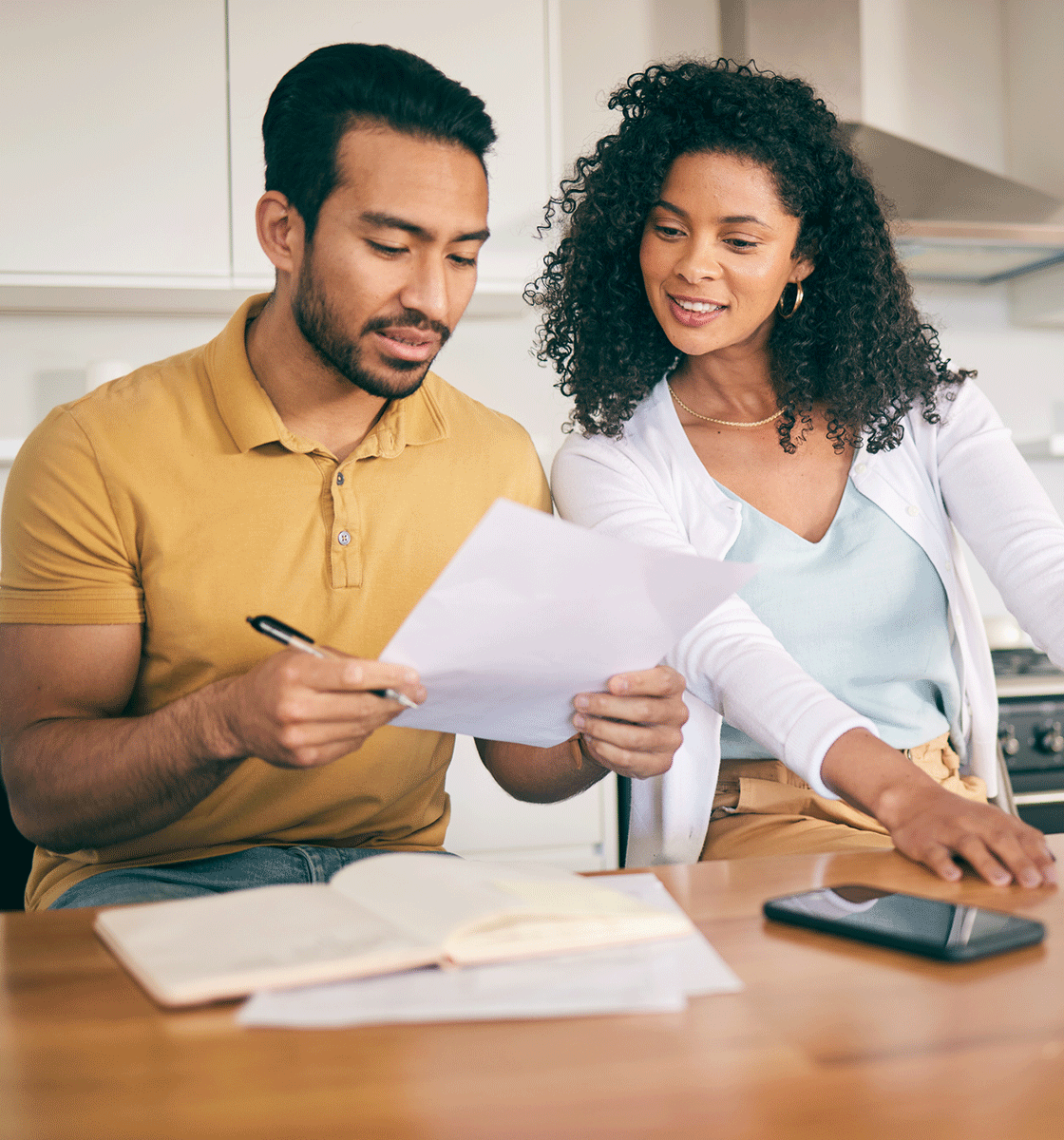 Couple looking over paperwork together and smiling